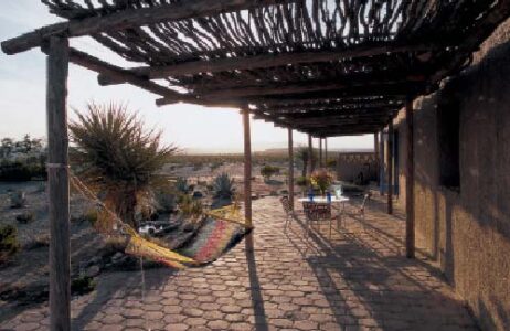 Covered Porch Of Off Grid Adobe Home